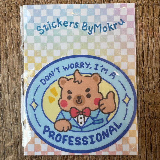 Sticker pack with a bear design and text 'Don't worry, I'm a professional' on a checkered background.